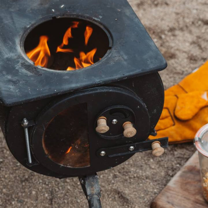 Anevay Frontier Plus portable wood burning stove set up on the beach